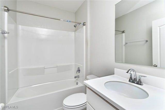 full bathroom with tub / shower combination, vanity, and toilet