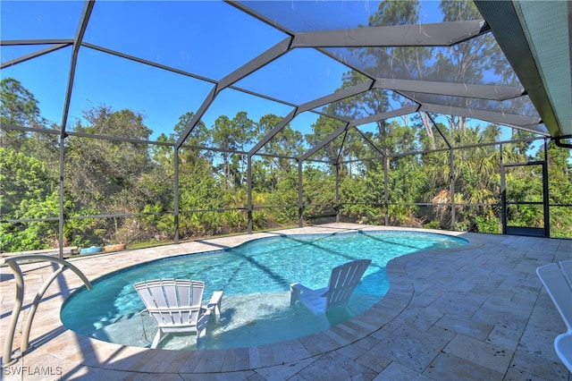 view of pool featuring a patio and a lanai