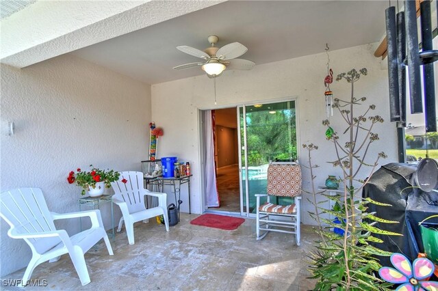 view of patio featuring ceiling fan