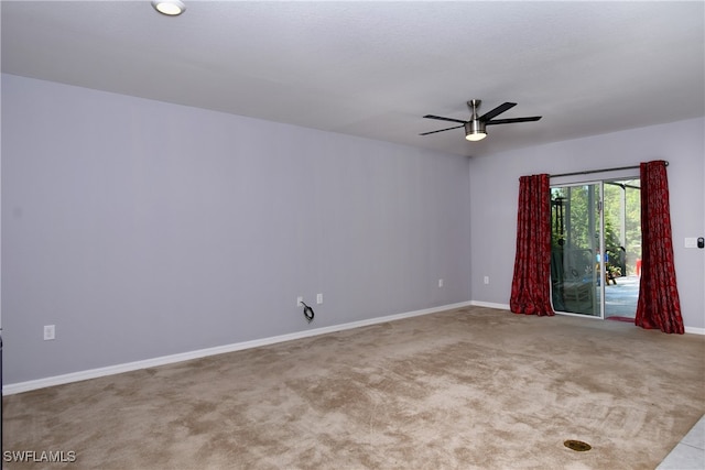 empty room with ceiling fan and light colored carpet