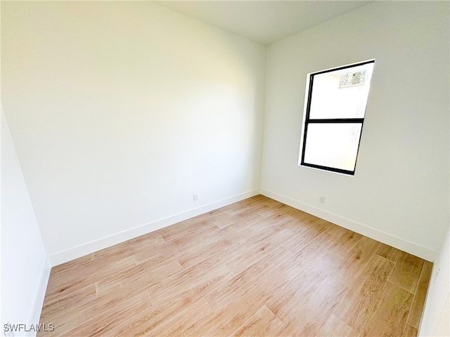 unfurnished room featuring light wood-type flooring