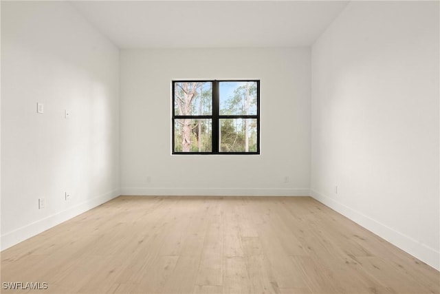 unfurnished room featuring light wood-type flooring