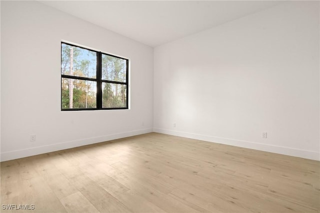 spare room featuring light hardwood / wood-style floors