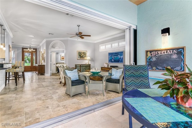 living room featuring french doors, ceiling fan, and crown molding