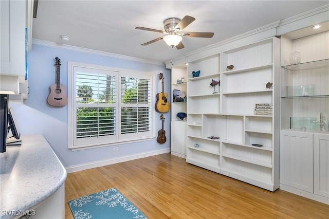 interior space featuring light hardwood / wood-style flooring, ceiling fan, and ornamental molding