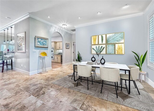 dining area with crown molding