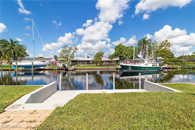 dock area featuring a yard and a water view