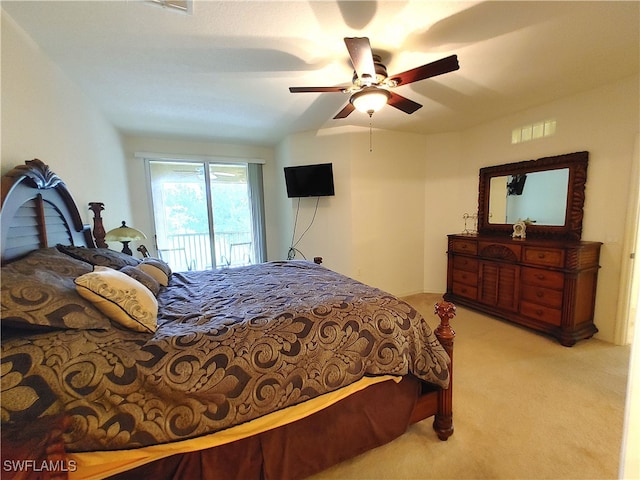 bedroom with ceiling fan, lofted ceiling, light carpet, and access to outside