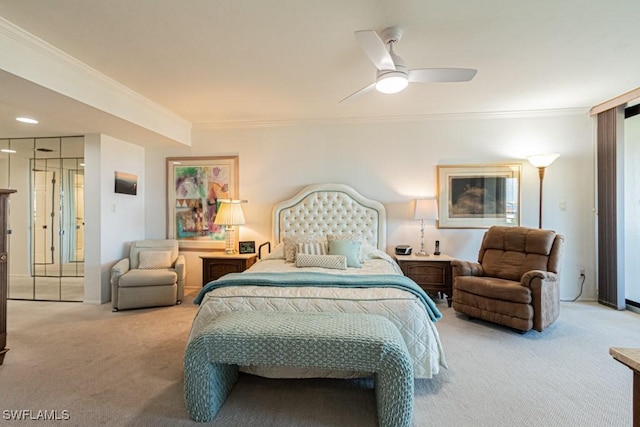 carpeted bedroom with ornamental molding and ceiling fan