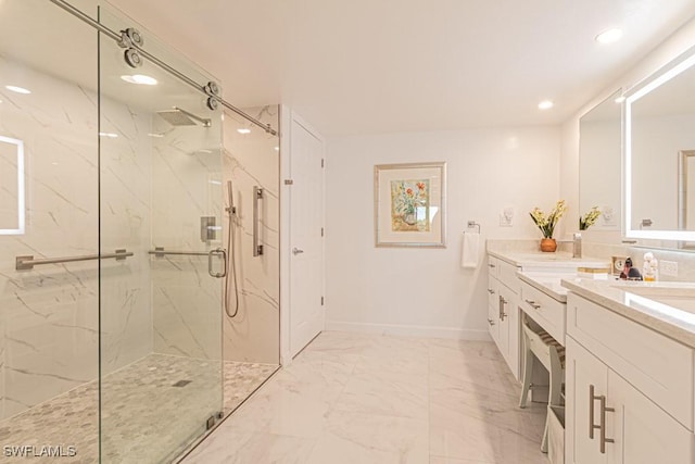 bathroom featuring vanity and a shower with door