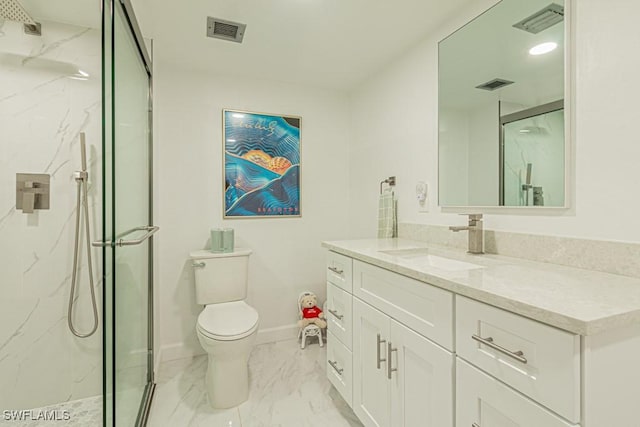 bathroom featuring a shower with door, vanity, and toilet