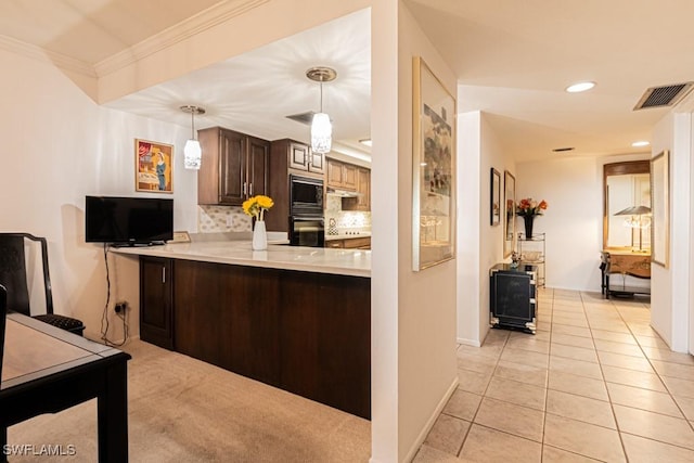 kitchen with light tile patterned flooring, dark brown cabinets, black microwave, ornamental molding, and backsplash