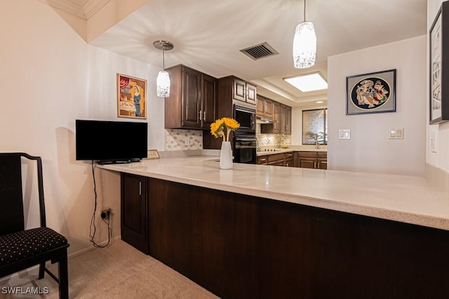 5260 S Landings Dr Unit 605, Fort Myers, FL 33919 - kitchen with black appliances, a peninsula, light countertops, carpet, and backsplash