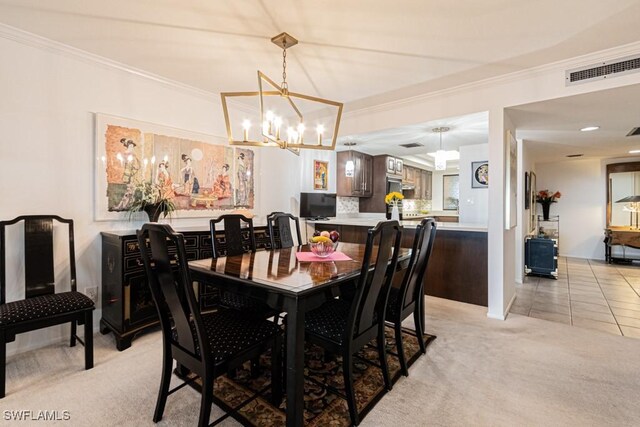 carpeted dining room with an inviting chandelier and ornamental molding