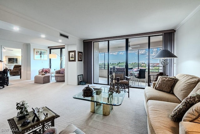 carpeted living room featuring expansive windows and ornamental molding