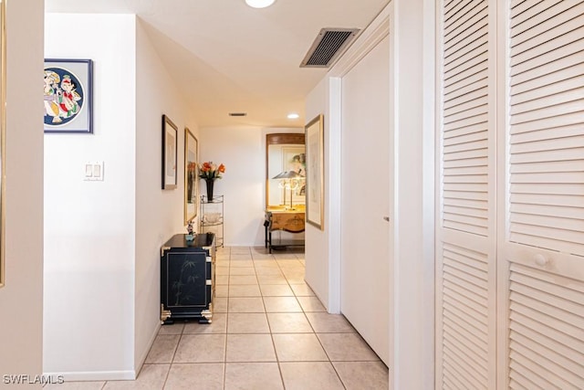 corridor featuring light tile patterned floors