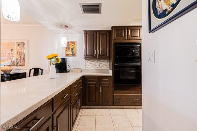 kitchen featuring decorative light fixtures, backsplash, light tile patterned floors, dark brown cabinetry, and black appliances