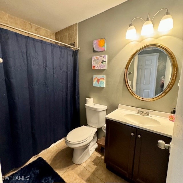 bathroom with vanity, toilet, tile patterned floors, and a shower with curtain