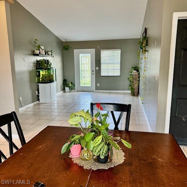 dining area featuring light tile patterned floors