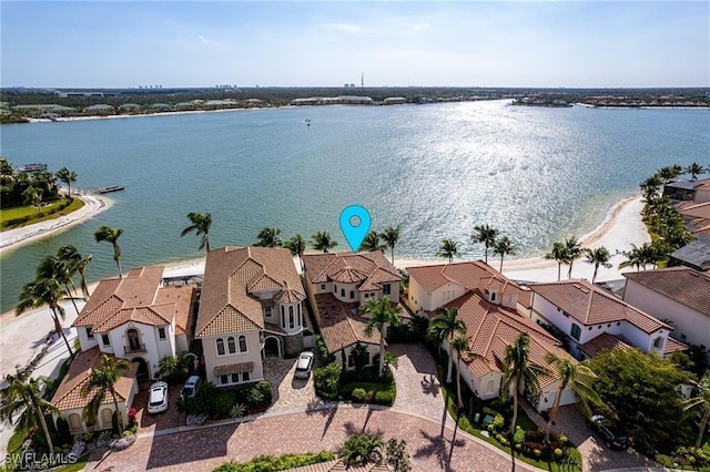 birds eye view of property with a water view