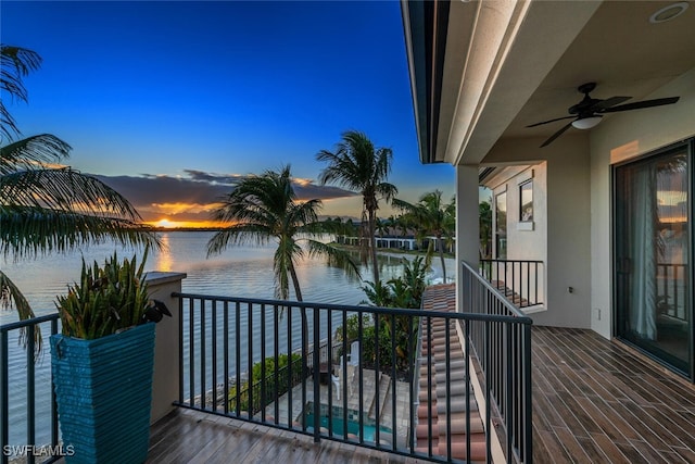 exterior space featuring a water view and ceiling fan