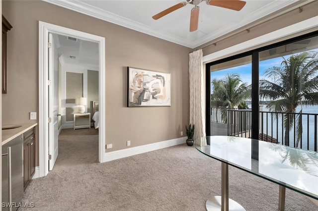 unfurnished office with light colored carpet and crown molding