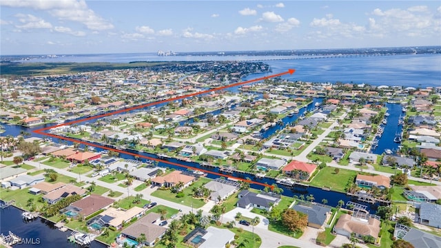 drone / aerial view with a water view