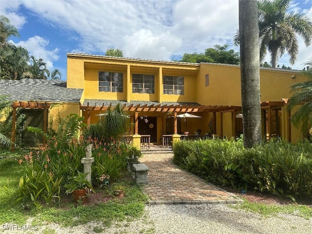 view of front of home featuring a pergola