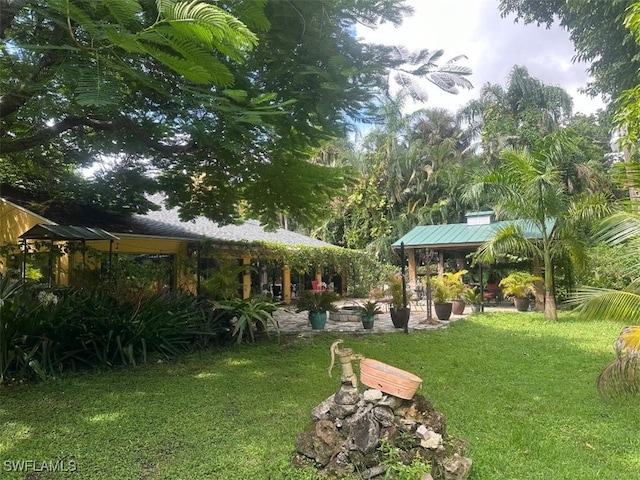 view of yard featuring a patio and a gazebo