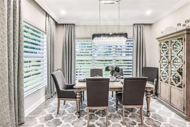 dining room featuring crown molding and hardwood / wood-style floors