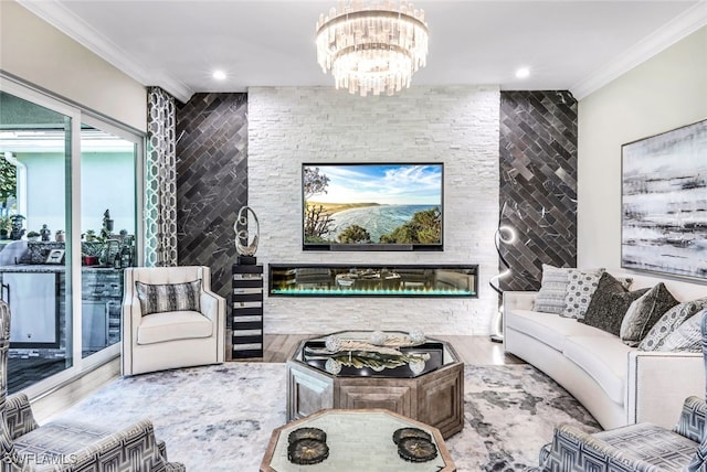 living room with ornamental molding, hardwood / wood-style floors, and a notable chandelier