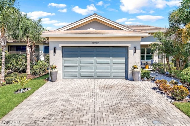 single story home with a garage