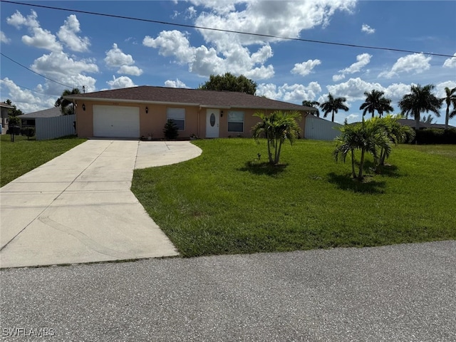 ranch-style home with a front yard and a garage