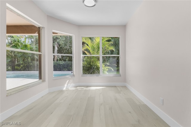 unfurnished sunroom with a healthy amount of sunlight