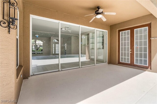 view of patio with ceiling fan and french doors