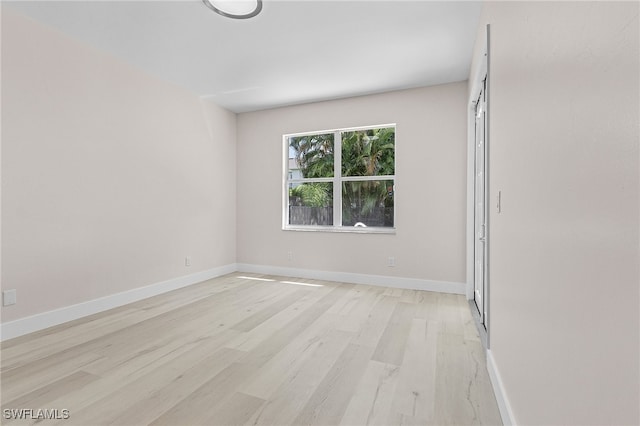 spare room with light wood-type flooring