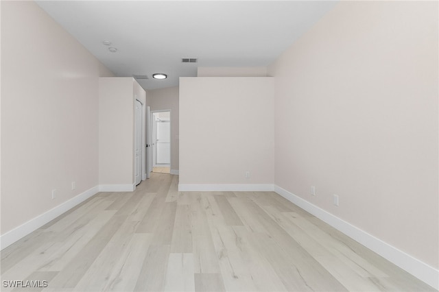 unfurnished room with light hardwood / wood-style flooring