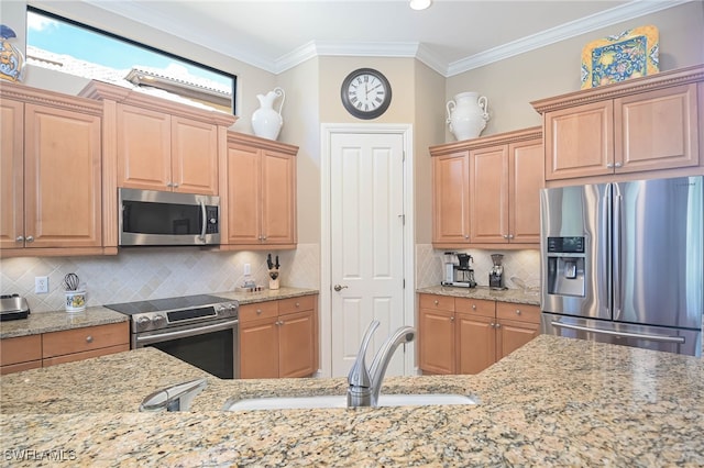 kitchen with backsplash, stainless steel appliances, ornamental molding, and sink