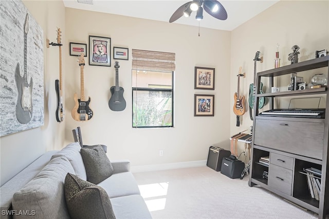 living room with light carpet and ceiling fan