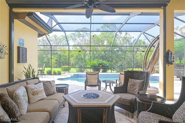 view of patio / terrace with outdoor lounge area, ceiling fan, and glass enclosure