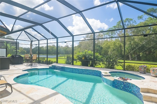 view of swimming pool featuring a patio, a lanai, and pool water feature