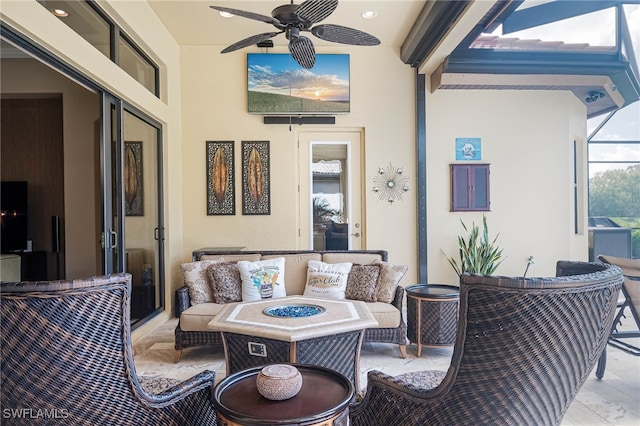 view of patio with outdoor lounge area, a lanai, and ceiling fan