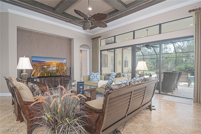 tiled living room featuring beam ceiling, coffered ceiling, and ornamental molding