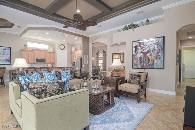 tiled living room with ceiling fan, coffered ceiling, ornamental molding, and beam ceiling