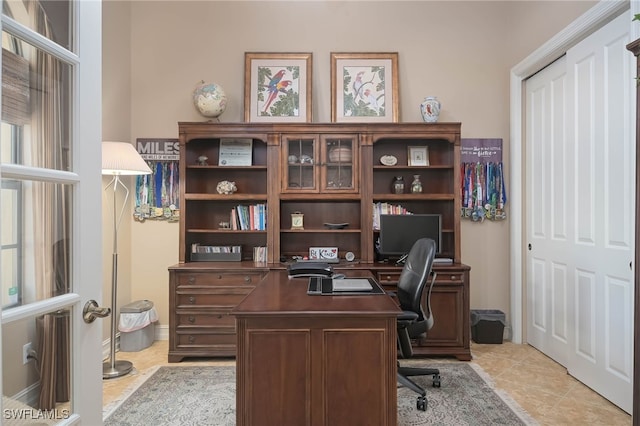 home office featuring light tile patterned floors