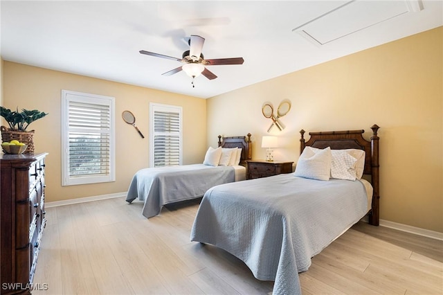 bedroom with light hardwood / wood-style flooring and ceiling fan