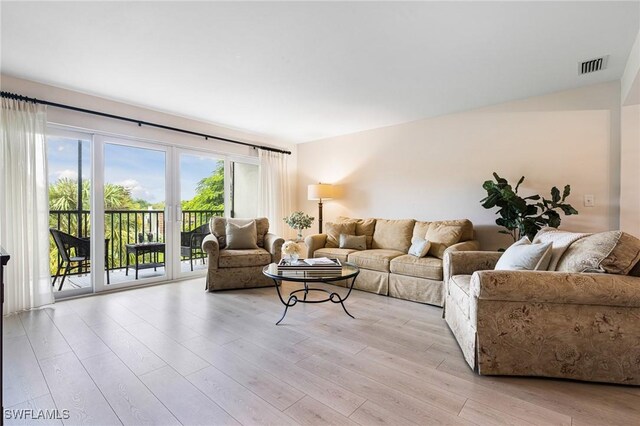 living room with light hardwood / wood-style floors