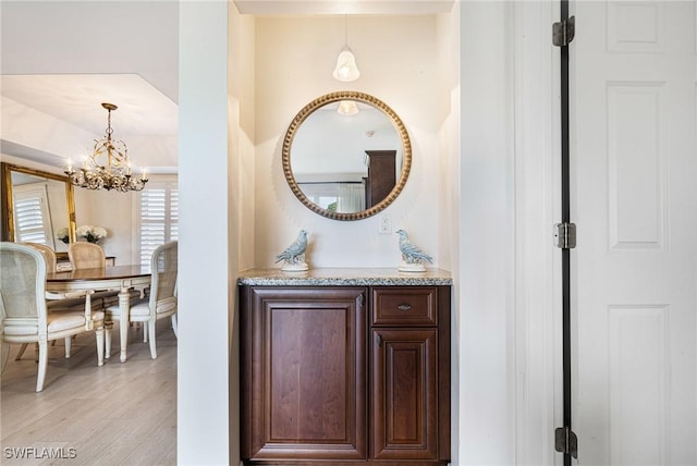 bathroom with vanity and hardwood / wood-style flooring