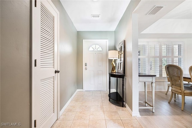 entrance foyer featuring light tile patterned floors