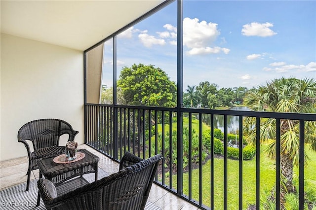 balcony featuring a water view